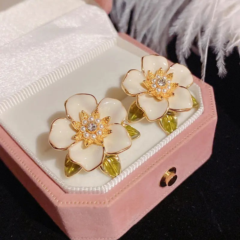 Enamel oil painted flower stud earrings.