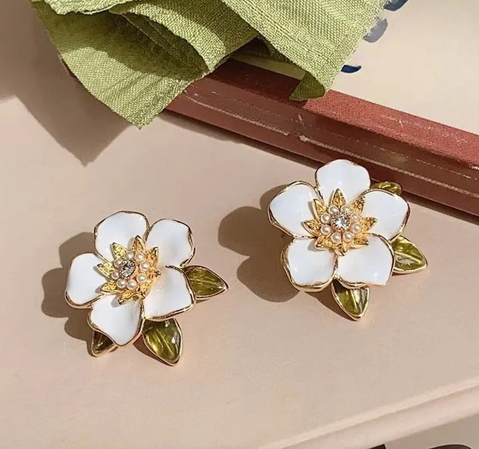 Enamel oil painted flower stud earrings.