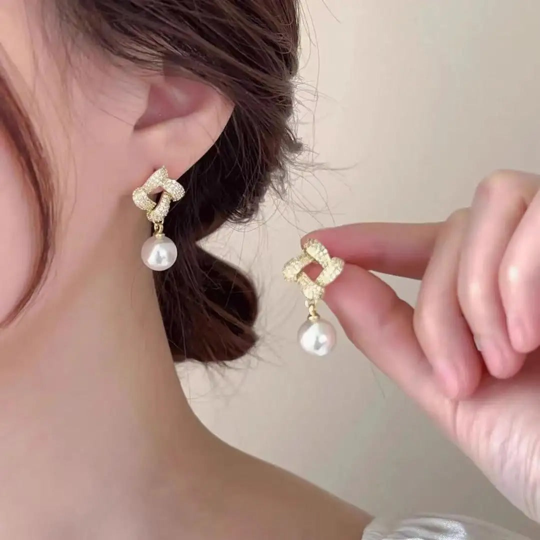 Geometric square pearl earrings.