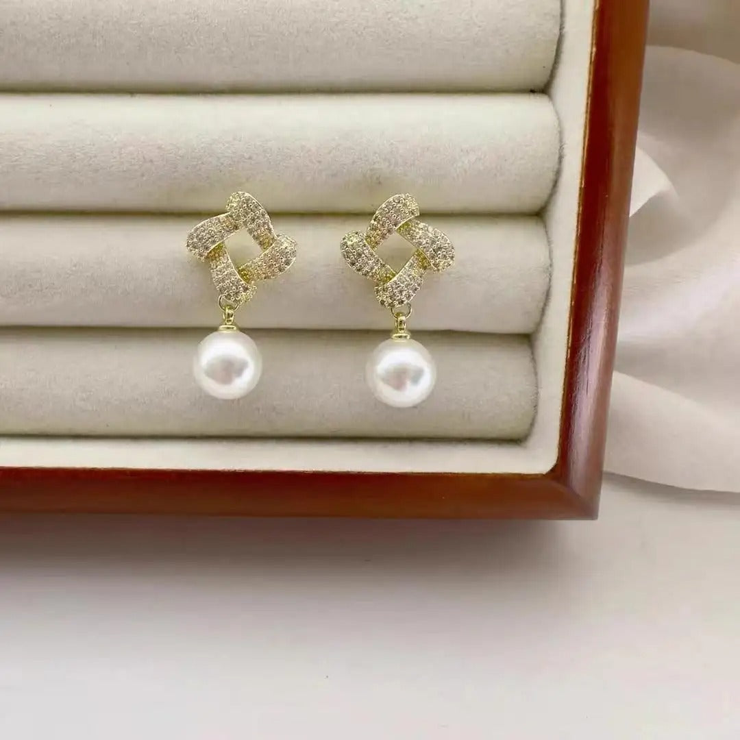 Geometric square pearl earrings.