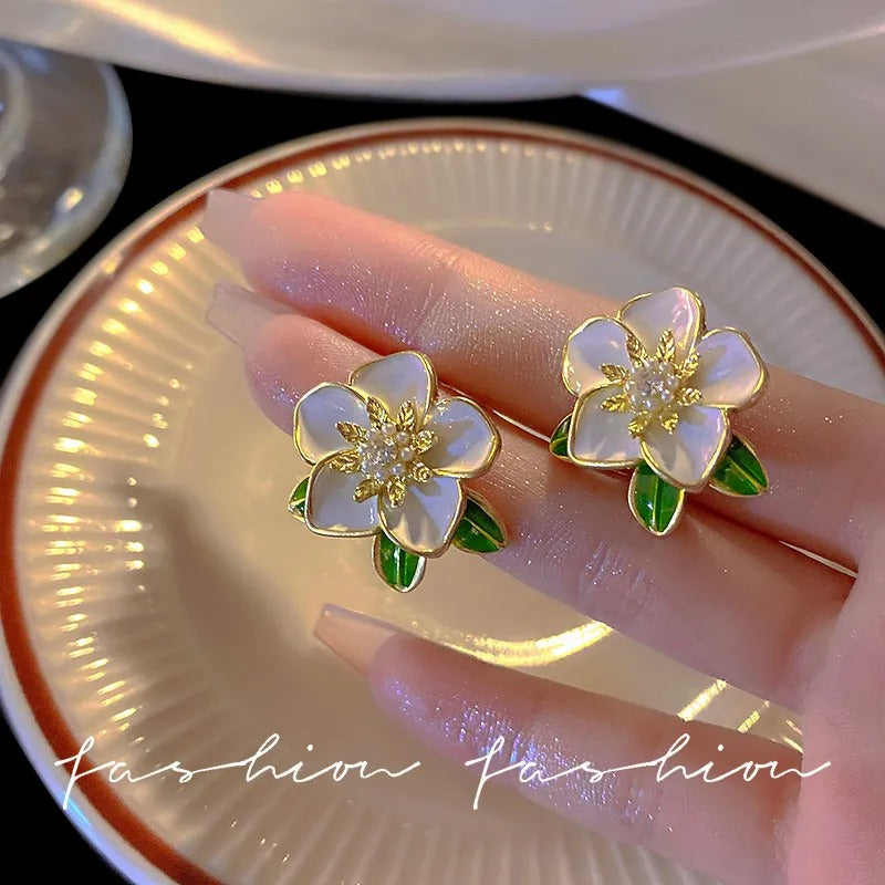 Enamel oil painted flower stud earrings.