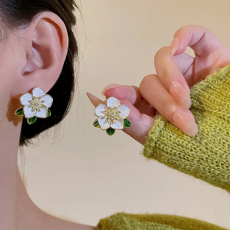 Enamel oil painted flower stud earrings.