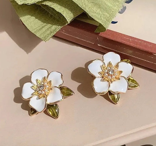 Enamel oil painted flower stud earrings.