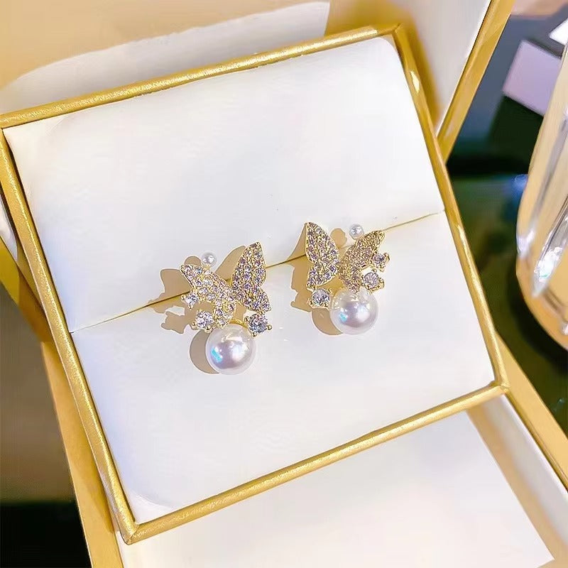 stones inlaid pearl Butterfly stud earrings.