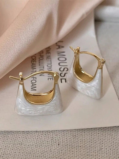 Enamelled bag shape earrings.